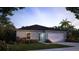 Charming single-story home with a well-manicured lawn and attached two-car garage at 14037 Canada Goose Rd, Brooksville, FL 34614