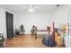 Bright office featuring hardwood floors, white ceiling fan, and ample natural light at 2647 Running Oak Ct, North Port, FL 34289