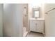 Updated bathroom featuring modern vanity and tiled shower at 8744 Candlewick Ln, Port Richey, FL 34668