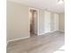 Spacious bedroom with gray floors and a ensuite bathroom at 8744 Candlewick Ln, Port Richey, FL 34668