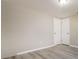 Neutral bedroom featuring grey flooring and a closet with double doors at 8744 Candlewick Ln, Port Richey, FL 34668