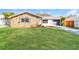 Charming single Gathering home with a stone facade and well-manicured front lawn at 8744 Candlewick Ln, Port Richey, FL 34668