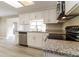 Bright kitchen with stainless steel appliances and granite countertops at 8744 Candlewick Ln, Port Richey, FL 34668