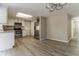 Updated kitchen with stainless steel appliances and white cabinetry at 8744 Candlewick Ln, Port Richey, FL 34668