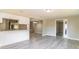 Open-concept living space with updated flooring and neutral color palette at 8744 Candlewick Ln, Port Richey, FL 34668