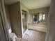 Bathroom featuring a glass shower and double vanity with lighting at 131 49Th E Ct, Palmetto, FL 34221
