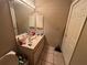 Bathroom featuring a single vanity sink and beige tile flooring at 131 49Th E Ct, Palmetto, FL 34221