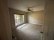 Comfortable bedroom featuring a ceiling fan and a window for natural light at 131 49Th E Ct, Palmetto, FL 34221