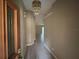 Inviting entryway with neutral walls, tile floors, and decorative chandelier at 131 49Th E Ct, Palmetto, FL 34221