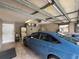 View of garage featuring car, washer, dryer, and storage space at 131 49Th E Ct, Palmetto, FL 34221
