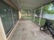 Spacious screened-in porch with large windows and view of the backyard at 131 49Th E Ct, Palmetto, FL 34221