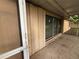 A view of the outside porch, equipped with accordion shutters at 131 49Th E Ct, Palmetto, FL 34221