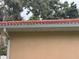 Close-up of a tile roof and white rain gutter at 131 49Th E Ct, Palmetto, FL 34221