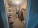 Walk-in closet with built-in shelving and rod for organized storage at 131 49Th E Ct, Palmetto, FL 34221