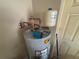 Water heater with expansion tank and copper plumbing, ensuring efficient hot water supply at 131 49Th E Ct, Palmetto, FL 34221