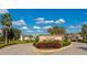Stone community sign for Vilano, surrounded by beautifully manicured landscaping at 7315 Bianco Duck Ct, Sarasota, FL 34240