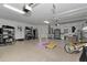 Spacious three car garage featuring epoxy flooring and ample storage and shelving at 7315 Bianco Duck Ct, Sarasota, FL 34240