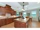 Well-equipped kitchen with granite counters, custom cabinets, and tile flooring at 7315 Bianco Duck Ct, Sarasota, FL 34240