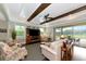 Comfortable living room with decorative beams and sliding glass doors to the lanai at 7315 Bianco Duck Ct, Sarasota, FL 34240