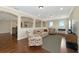 Open living room with hardwood floors, comfortable seating, and plenty of natural light at 7315 Bianco Duck Ct, Sarasota, FL 34240
