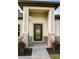 Elegant front door with decorative glass and stone columns at the entry at 1857 Spaniel Ave, North Port, FL 34288