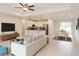 Open-concept living area featuring tile flooring, recessed lighting, and seamless flow to the modern kitchen at 1857 Spaniel Ave, North Port, FL 34288