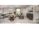 Spacious living area with tile flooring and lots of natural light, with modern furniture and décor at 11427 Pickford St, Spring Hill, FL 34609