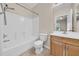 A full bathroom featuring a tub/shower combination and wooden vanity at 5857 Fishhawk Ridge Dr, Lithia, FL 33547