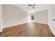 Bright, airy bedroom featuring hardwood floors and a ceiling fan at 5857 Fishhawk Ridge Dr, Lithia, FL 33547