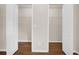 Walk-in closet featuring wood floors and shelving at 5857 Fishhawk Ridge Dr, Lithia, FL 33547