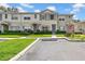 Charming townhouse with blue shutters and well-manicured landscaping at 5857 Fishhawk Ridge Dr, Lithia, FL 33547
