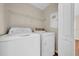 A dedicated laundry room with modern washer and dryer units at 5857 Fishhawk Ridge Dr, Lithia, FL 33547