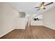 Open-concept living space showcasing hardwood floors and easy access to kitchen at 5857 Fishhawk Ridge Dr, Lithia, FL 33547