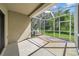 Screened-in patio area with concrete floor and view of the backyard at 5857 Fishhawk Ridge Dr, Lithia, FL 33547