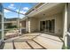 Enclosed patio with concrete flooring and view of the backyard at 5857 Fishhawk Ridge Dr, Lithia, FL 33547
