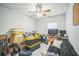 Bedroom featuring a ceiling fan and natural light, currently used for storage at 3610 N Tampa St, Tampa, FL 33603