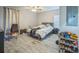 Bedroom featuring a ceiling fan, an unmade bed, and a shoe rack in a staged home at 3610 N Tampa St, Tampa, FL 33603