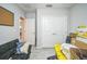 Multi-purpose room with a futon and closet space, currently used for storage and organization at 3610 N Tampa St, Tampa, FL 33603