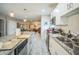 Well-lit kitchen featuring a granite countertop, stainless steel appliances, and white subway tile backsplash at 3610 N Tampa St, Tampa, FL 33603