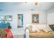 Comfortable living room with a large sofa, artwork, and doorway views, creating an inviting atmosphere at 3610 N Tampa St, Tampa, FL 33603