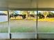 Screened patio overlooking a large grassy backyard at 4147 Kingsfield Dr, Parrish, FL 34219