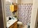 Clean bathroom with shower/tub combo, vanity, and linen storage at 4147 Kingsfield Dr, Parrish, FL 34219