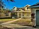 House exterior with a screened porch and landscaping at 4147 Kingsfield Dr, Parrish, FL 34219