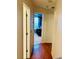 Bright hallway with wood flooring and access to bedrooms at 4147 Kingsfield Dr, Parrish, FL 34219