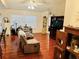 Living room with hardwood floors and comfortable seating at 4147 Kingsfield Dr, Parrish, FL 34219