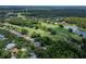 Aerial view showcases the community's proximity to the golf course and lake at 8749 Ashworth Dr, Tampa, FL 33647