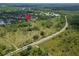 An aerial shot showcases the home's location near lush woodlands at 8749 Ashworth Dr, Tampa, FL 33647