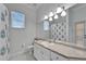Full bathroom with a white shower curtain, sink with a mirror, and a toilet at 8749 Ashworth Dr, Tampa, FL 33647
