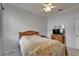 Bedroom with neutral colored walls, ceiling fan and light grey flooring at 8749 Ashworth Dr, Tampa, FL 33647