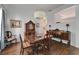 Dining room featuring hardwood floors, stylish furniture, a decorative china cabinet, and natural light at 8749 Ashworth Dr, Tampa, FL 33647